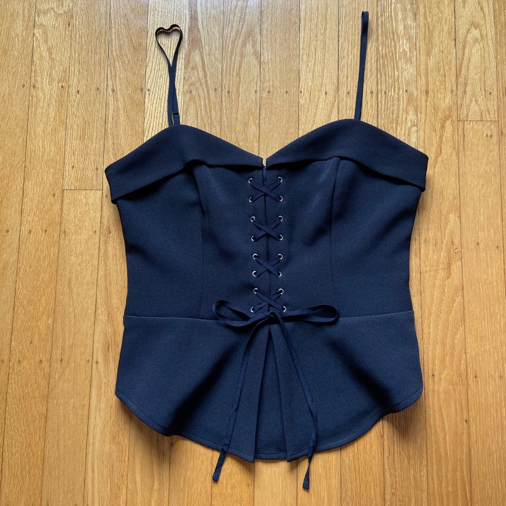 Black sleeveless top with lacing details